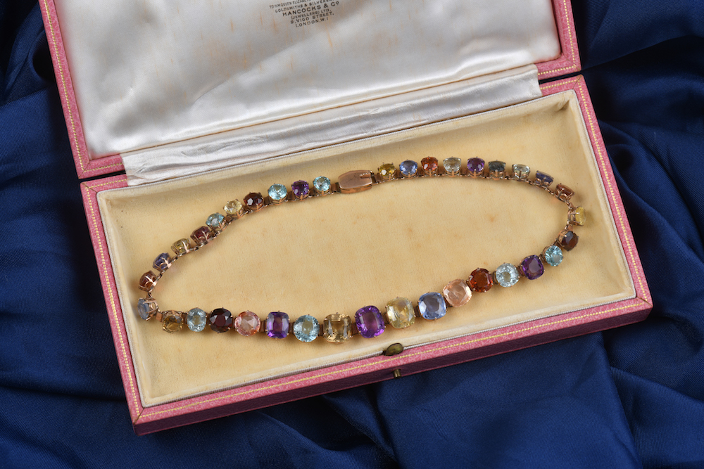 A C1900 Rose Gold Necklace Set With Twelve Natural Ceylon Sapphires, Garnet, Citrine, Amethyst, Zircons And Quartz. Sold For £9500