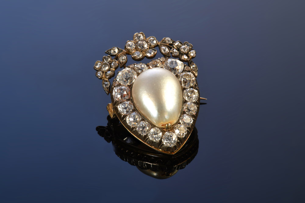 Victorian Brooch In The Form Of A Heart Set With A Large Natural Pearl Surrounded By Diamonds. Sold For £8400