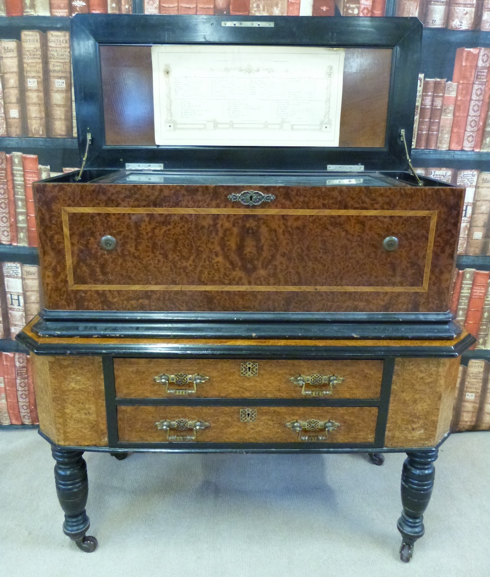 A 19Thc Interchangeable Orchestral Cylinder Musical Box In Burr Walnut Case With Banding To The Lid And Sides, Mounted On A Matching Table Sold Ś6,000