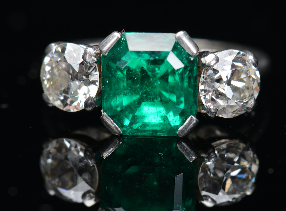 An 18Ct White Gold Ring Set With An Emerald And Diamonds. Sold For £5000